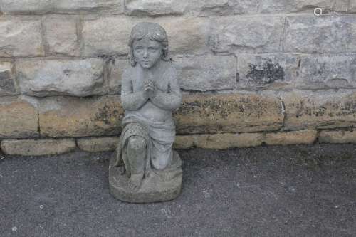 A Stone Figure of a Child Praying; the figure in a kneeling position, approx 30 x 66 x 26 cms