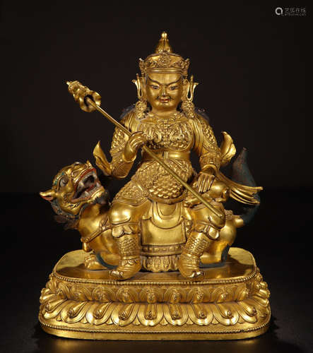 TIBETAN GILT BRONZE SEATED YELLOW JAMBHALA ON BEAST