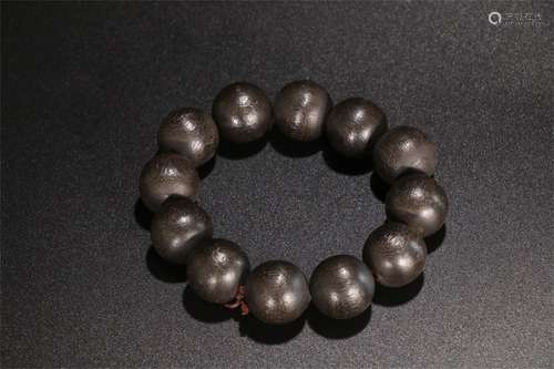 A Chinese Carved Agar-Wood Bracelet