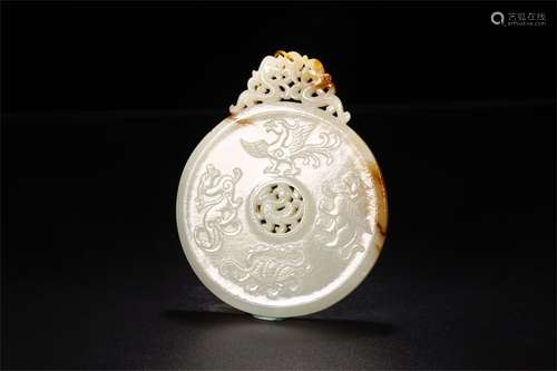 A Chinese Carved Jadeite Pendant