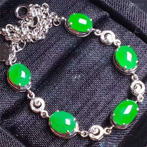 A Chinese Carved Jadeite Bracelet