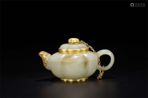 A Chinese Carved Jade Tea Pot with Gilt Silver Inlaid