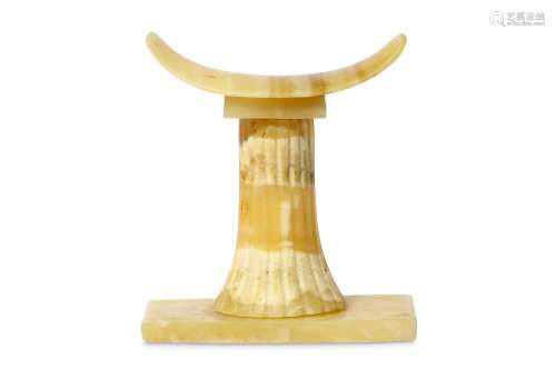 AN EGYPTIAN ALABASTER HEADREST