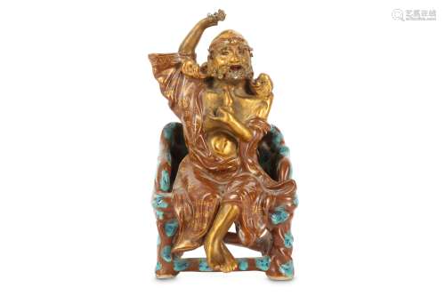 A CHINESE GILT-DECORATED ROBIN'S EGG-GLAZED FIGURE OF AN IMMORTAL.