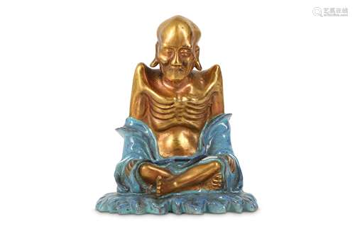 A CHINESE GILT-DECORATED ROBIN'S EGG-GLAZED FIGURE OF A LUOHAN.