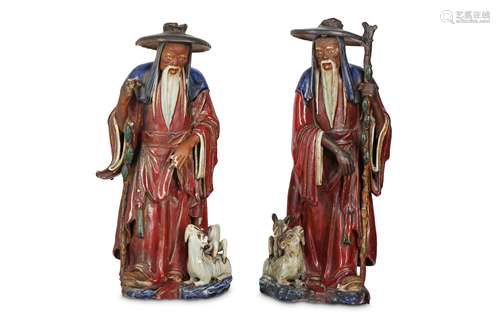 A PAIR OF CHINESE SHIWAN FIGURES OF IMMORTALS.