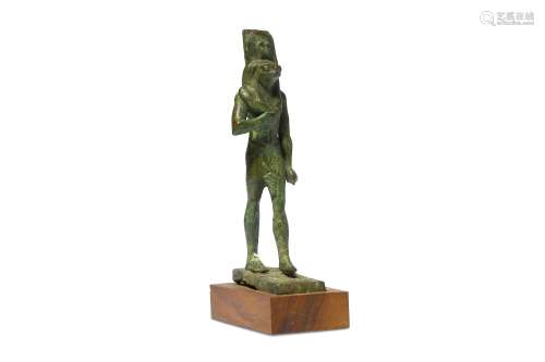 AN EGYPTIAN BRONZE FIGURE OF A FALCON-HEADED GOD