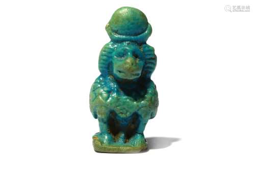 AN EGYPTIAN GLAZED COMPOSITION BABOON AMULET