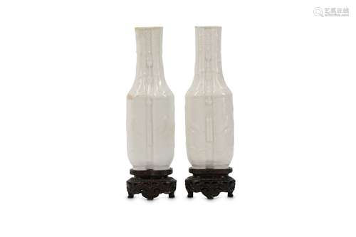 A PAIR OF WHITE-GLAZED SOFT PASTE CONJOINED VASES.