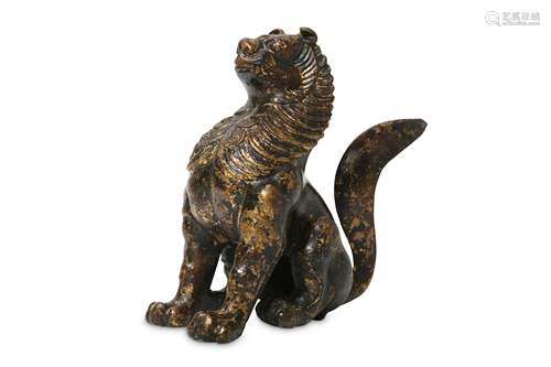 A CHINESE GILT-BRONZE FIGURE OF A SEATED LION.