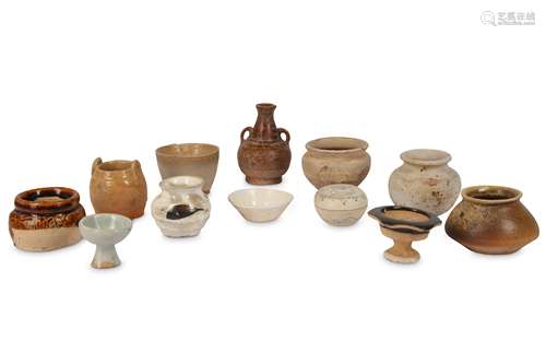 A COLLECTION OF TWELVE SMALL CHINESE POTTERY JARS.