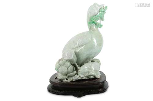 A CHINESE LIFESIZE APPLE GREEN JADEITE GOOSE.