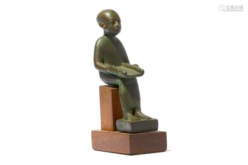 AN EGYPTIAN BRONZE FIGURE OF IMHOTEP