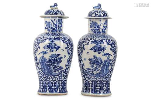 A PAIR OF CHINESE BLUE AND WHITE BALUSTER VASES AND COVERS.