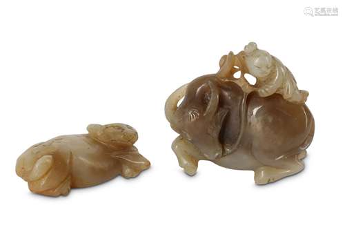 TWO CHINESE GREY-GREEN JADE 'BUFFALO' CARVINGS.