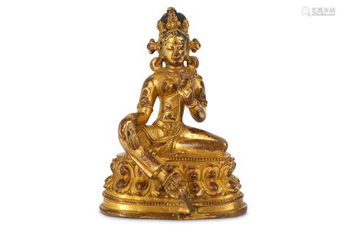 A TIBETAN GILT-COPPER FIGURE OF TARA.