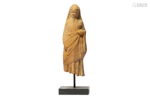 A HELLENISTIC TERRACOTTA FEMALE FIGURE