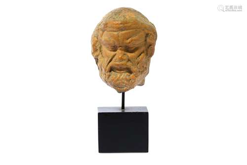 A GREEK TERRACOTTA HEAD OF SILENUS