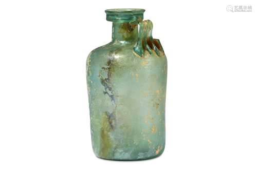 A ROMAN GREEN GLASS JUG