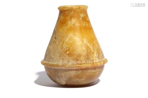 AN EGYPTIAN ALABASTER VESSEL