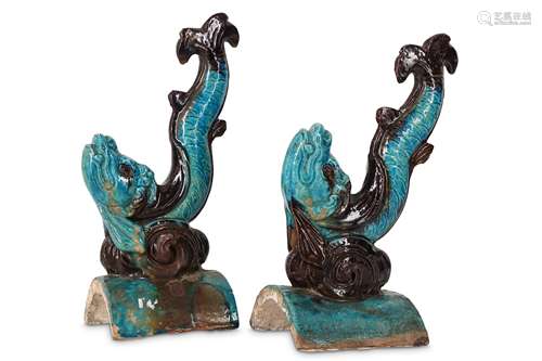 A PAIR OF CHINESE 'DRAGON FISH' TURQUOISE AND AUBERGINE-GLAZED ROOF TILES.