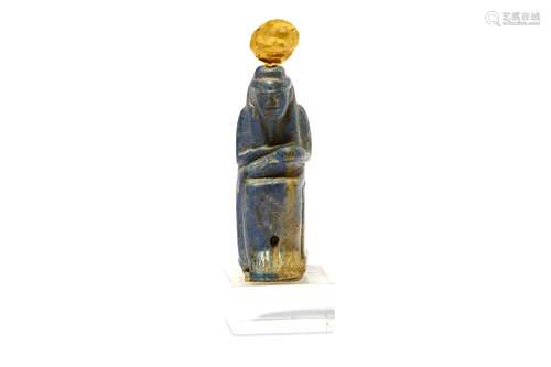 AN EGYPTIAN LAPIS LAZULI AMULET OF SEATED ISIS