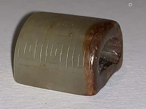 A Green-White Jade Seal Carved in a Roof-Tile Form