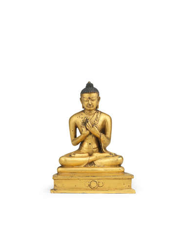 Tibet, 15th century  A rare gilt copper-alloy figure of Shakyamuni Buddha