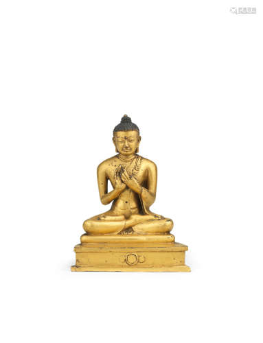 Tibet, 15th century  A rare gilt copper-alloy figure of Shakyamuni Buddha