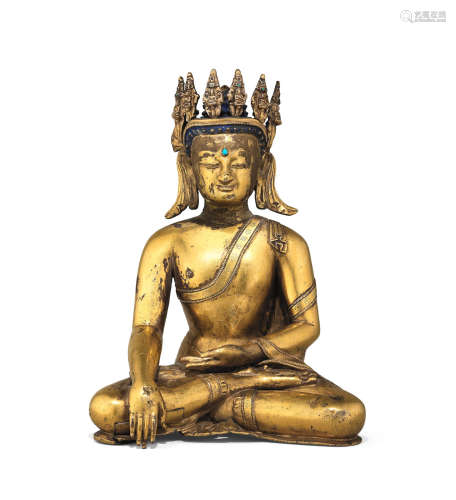 Tibet, 15th century A rare gilt copper-alloy figure of crowned Buddha