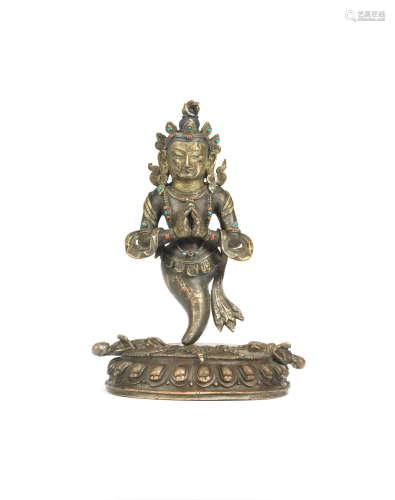 Tibet, 18th century  A rare gilt-bronze inscribed figure of Nāga King Karkota
