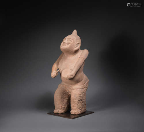 Han Dynasty A very rare carved stone figure of a drummer