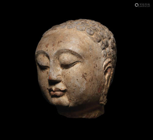 Sui Dynasty A superb carved polychrome limestone head of Buddha