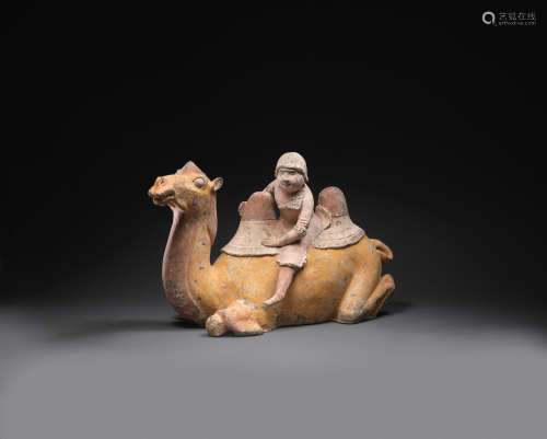 Tang Dynasty A painted pottery model of a Bactrian camel and rider