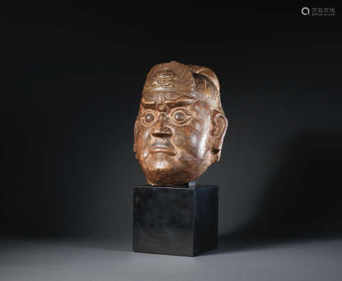 Ming Dynasty A carved limestone head of a guardian