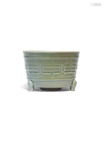 24.5cm (9 5/8in) diam.   A longquan celadon-glazed tripod incense burner  Ming Dynasty