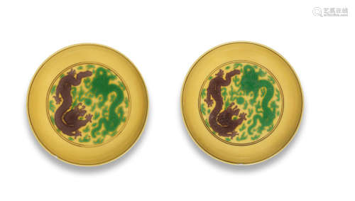 Qianlong seal marks and of the period A pair of yellow-ground green and aubergine-glazed saucer-dishes