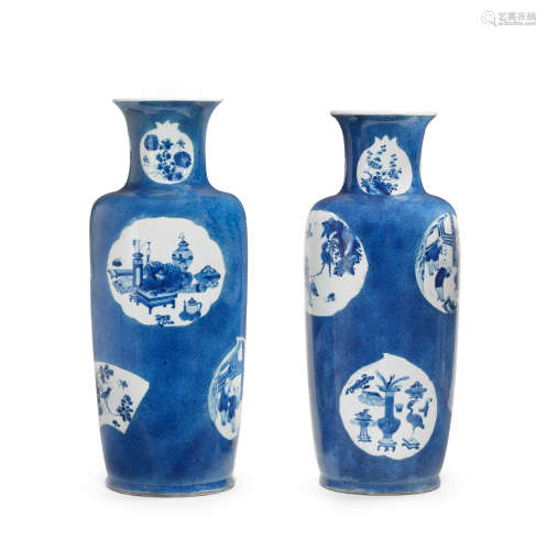 Kangxi  A large pair of blue and white powder-blue-ground rouleau vases