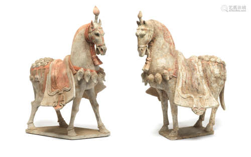 Northern Wei Dynasty  A near pair of painted pottery models of caparisoned horses