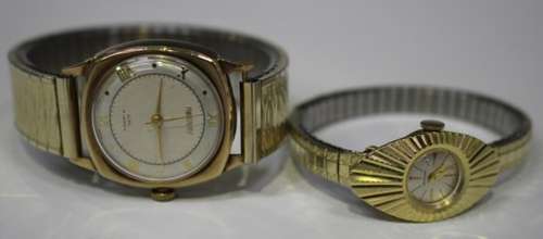 A Rotary 9ct gold cushion shaped gentleman's wristwatch, the signed silvered dial with alternating