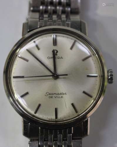 An Omega Seamaster Deville steel circular cased gentleman's bracelet wristwatch, the signed silvered