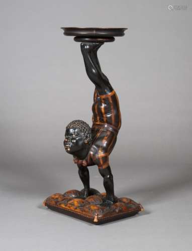 A late 19th century Venetian ebonized and carved softwood blackamoor visiting card stand, the