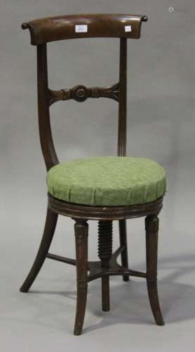 A William IV mahogany bar back cello chair, the revolving adjustable seat raised on turned