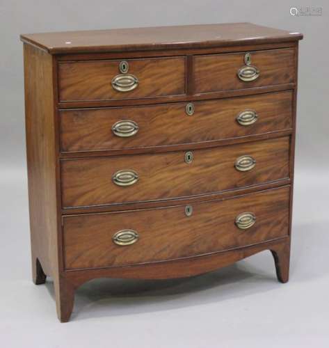A Regency mahogany bowfront chest of two short and three graduated long drawers, on bracket feet,
