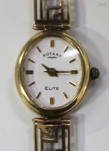 A Rotary Elite 9ct gold lady's bracelet wristwatch, the signed oval white dial with gilt baton