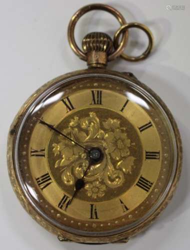 A 9ct gold cased keyless wind open-faced lady's fob watch with gilt cylinder movement, the gilt dial