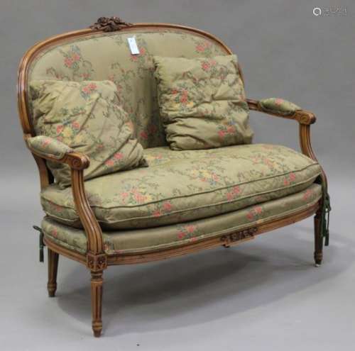 A late 20th century Louis XVI style stained beech two-seat showframe settee with carved
