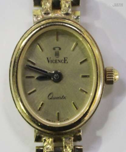 A Vicence Quartz 9ct gold lady's bracelet wristwatch, the signed oval gilt dial with baton hour