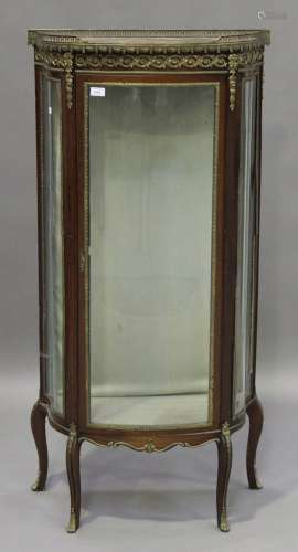 An early 20th century French vitrine with gilt metal mounts, the rouge marble top above a glazed