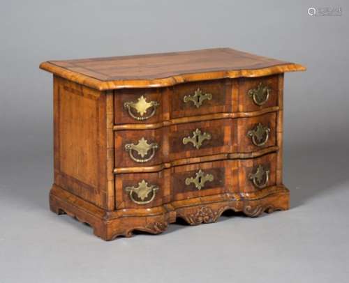 An 18th century Dutch walnut serpentine fronted table-top chest of three drawers, with crossbanded